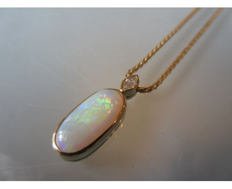 18ct Gold mounted opal and diamond pendant suspended from an 18ct gold chain