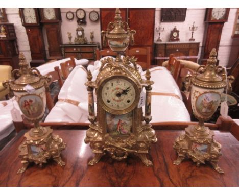 Reproduction French style gilt brass and ceramic three piece clock garniture