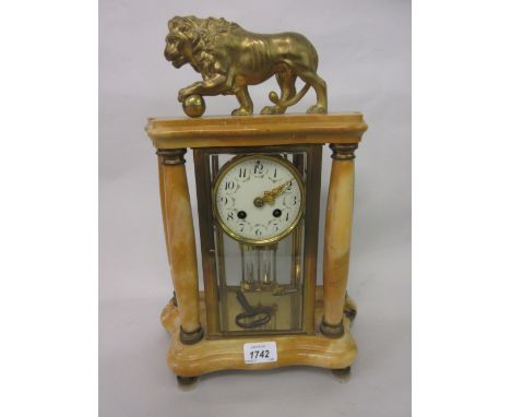 Late 19th or early 20th Century French gilt brass and yellow figured marble four glass library clock with portico style case 