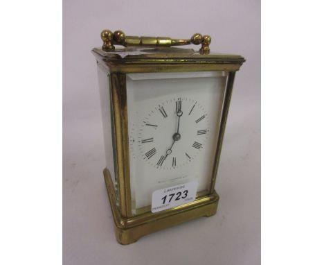 20th Century brass cased carriage clock having enamel dial with Roman numerals, inscribed Mackay Cunningham and Co. Paris (a/