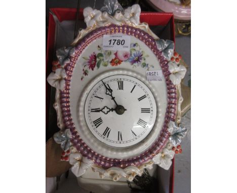 19th Century German porcelain wall clock having floral decoration and enamel dial with Roman numerals and a Schotlenwerk mech