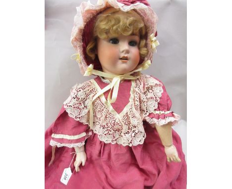Schoenau and Hoffmeister bisque headed doll with jointed body, numbered SPBH914/11