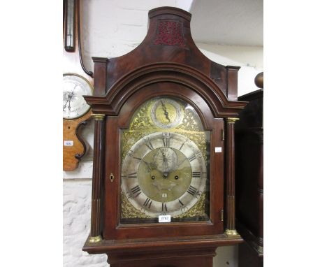 George III mahogany longcase clock, the arched hood above an arched panelled door and a rectangular plinth with bracket feet,