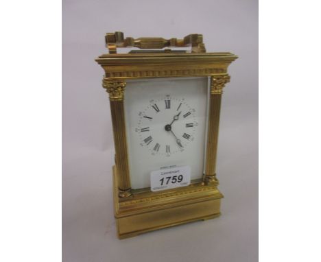Late 19th or early 20th Century gilt brass cased carriage clock with Corinthian corner pilasters, the enamel dial with Arabic