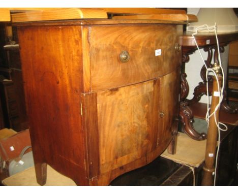 19th Century mahogany bow front commode with hinged lid above a pair of bowed panelled doors on bracket feet