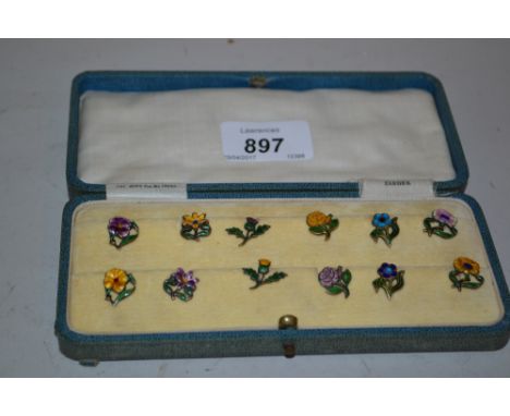 Cased set of twelve enamel decorated silver flower design cocktail clips, the box inscribed Zarger