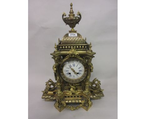 Large 19th Century French gilt brass mantel clock of ornate pagoda design with an urn surmount above fluted columns, entwined