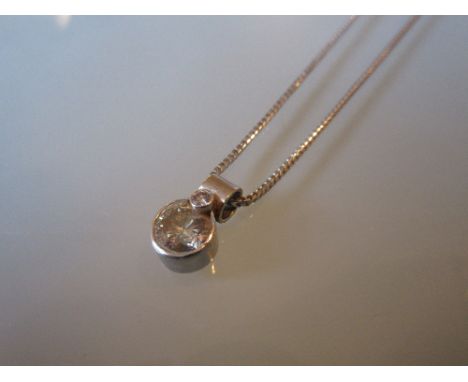 18ct White gold diamond pendant, the diamond approximately 1.50ct (chipped to one edge and over mounted with a small diamond)