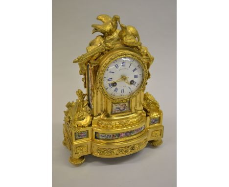19th Century ormolu and porcelain mounted mantel clock by Raingo Frères, the porcelain panels painted with cherub and flowers