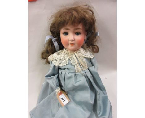 Schoenau & Hoffmeister bisque headed doll having fully jointed body with closing eyes and a silk dress