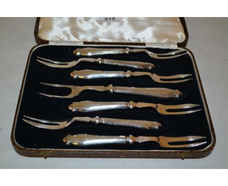 Cased set of six silver handled cake forks with serving fork