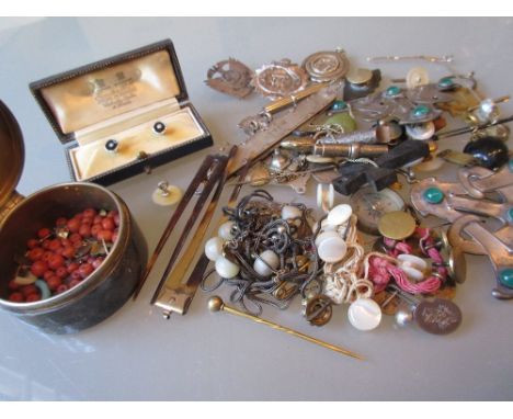 Circular silver trinket box containing a quantity of coral and other beads and a quantity of various small, silver and other 