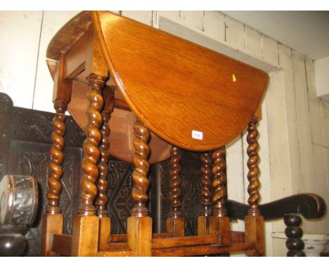 Small early 20th Century oak oval gate leg table on barley twist supports with stretchers