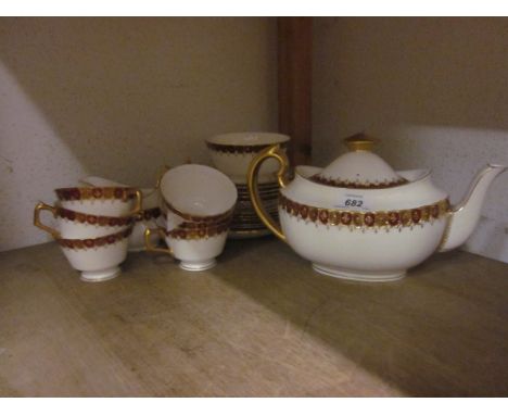 Royal Crown Derby six place setting tea service having red and gilt borders