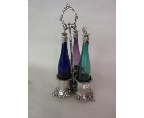 19th Century silver plated three bottle decanter stand with an associated set of three coloured glass decanters with plated m