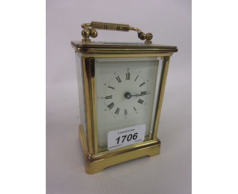 20th Century English gilt brass carriage clock, the enamel dial with Roman and Arabic numerals