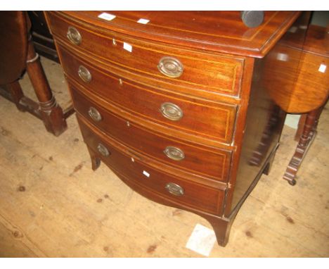 Small Edwardian mahogany and chequer line inlaid four drawer bow front chest with oval brass handles and splay bracket feet