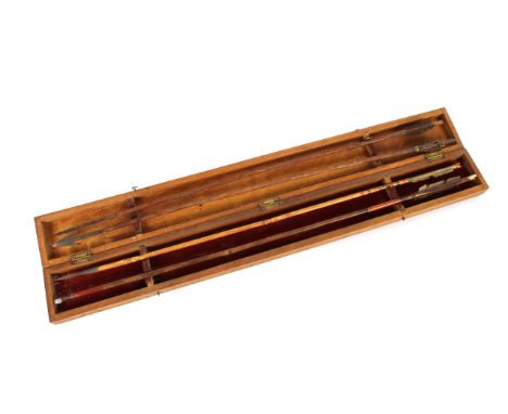 An Indian arrow box containing four arrows 