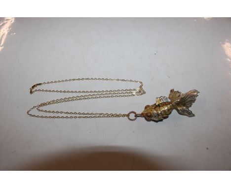 A large Sterling silver gilt enamel decorated articulated fish pendant and chain, 16gms 