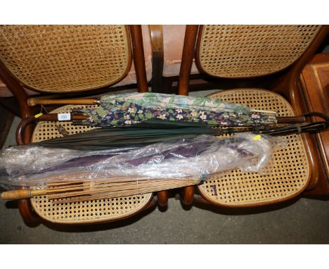 A quantity of vintage parasols