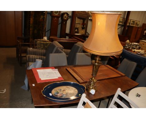 A brass table lamp and shade and a decorative tray