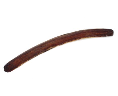 An Aboriginal boomerang with incised carving and scratch decoration to the ends, 59cm overall