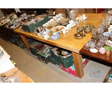 A large light oak extending dining table 