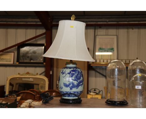 A blue and white Oriental decorated table lamp and shade 