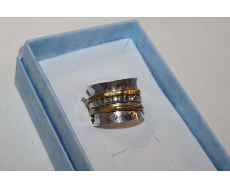 A Studio 925 Sterling silver hand planished swivel / worry ring, ring size K/L