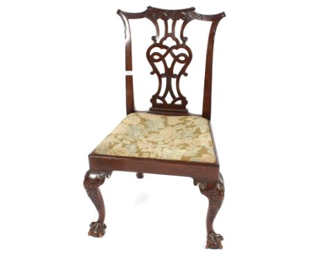 A 19th Century Chippendale design single carved mahogany dining or side chair with upholstered drop in seat raised on bold ca