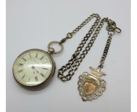 A silver pocket watch and chain 