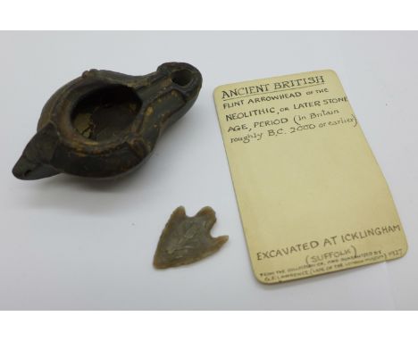 A Roman lamp and an arrow head 
