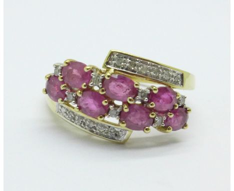 A 9ct gold, ruby and diamond crossover ring, 2.8g, Q 