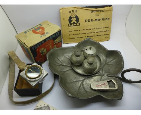 A pewter dish, a Selangor cruet, a compass, a Dux Kino, boxed, and an advertising bottle opener, John Taylor, Mansfield 