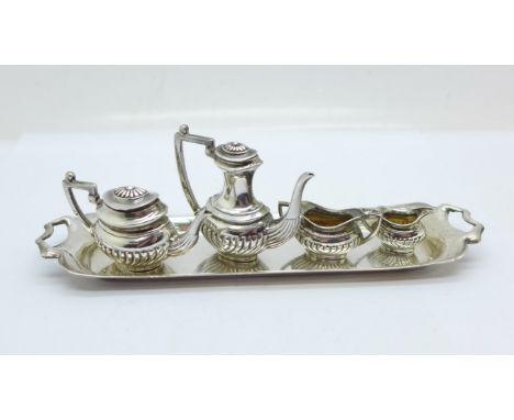 A miniature hallmarked silver tea service with tray 