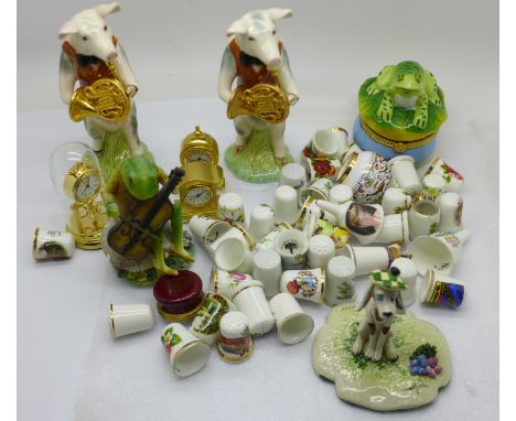 Two Beswick pig bandsman figures, two frog figures, a Neapolitan dog figure, a collection of ceramic thimbles and three minia