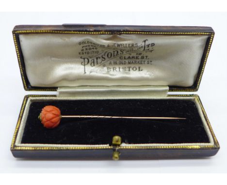 A 9ct gold and carved coral stick pin with box 