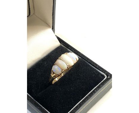 18ct gold opal and diamond ring, ring size approx o/p 4.2g, good overall condition,&nbsp;The opals are not the same shade, on