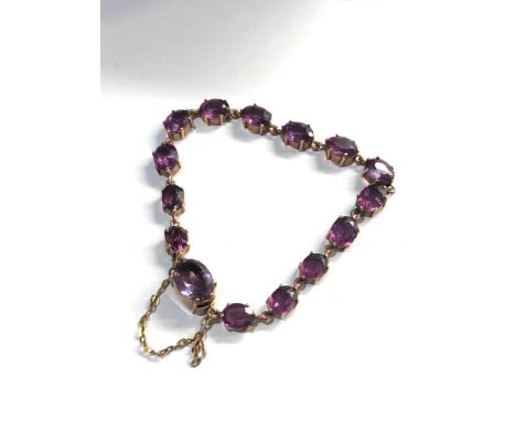 9ct gold amethyst coloured gem set bracelet 