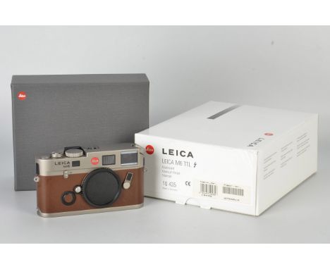 A Leica M6 TTL Titanium Rangefinder Camera, brown calf skin, serial no. 2754612, body, E, shutter working, with documents and