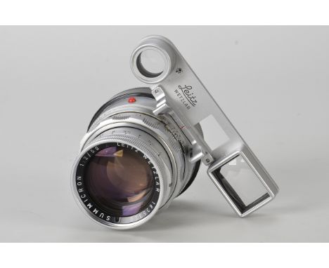 A Leitz Summicron f/2 50mm Lens, with eyes, dual range, chrome, serial no. 1835320, body, VG, elements, G-VG, some internal h