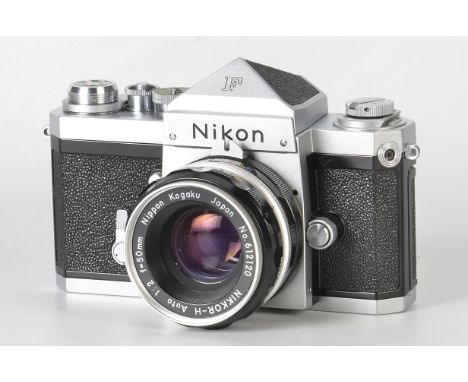A Nikon F Eyelevel SLR Camera, chrome, serial no. 6562528, with Nikkor-H f/2 50mm lens, chrome, serial no. 612120, body, E, s