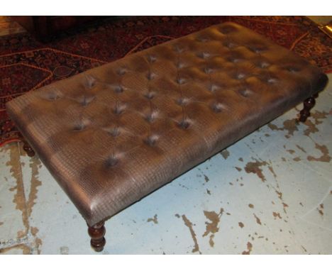 HEARTH STOOL, faux skin covered button top on turned supports and castors, 123cm W x 82cm D. 