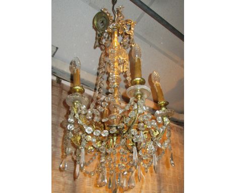 CHANDELIER, six branch gilt metal with cut glass droplets, 74cm H x 47cm.