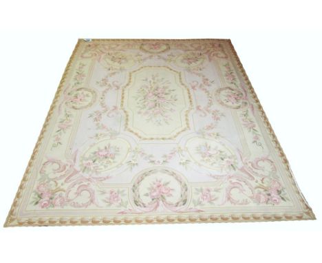 FINE SAVONERIE NEEDLEPOINT CARPET, 344cm x 263cm, of a floral cartouche medallion on aquamarine field and jade laurel borders