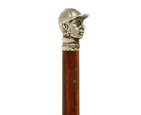 A walking stick,with cast metal jockey's head finial,83cm long