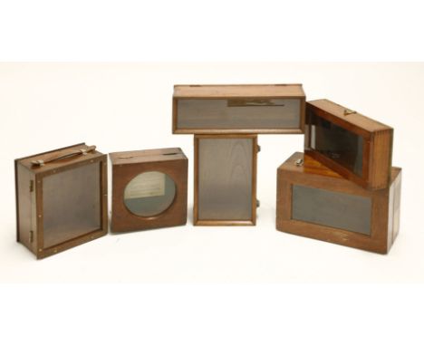 Unusual display boxes,a group of six early 20th century scientific instrument boxes each with a glass display panel,largest 3