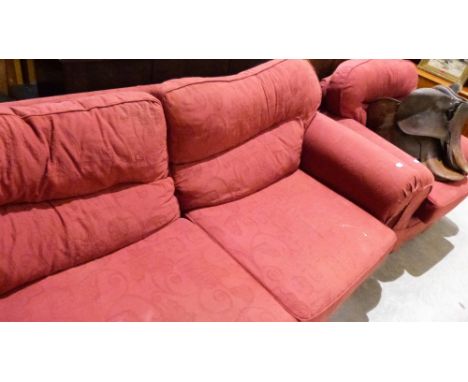 A sofa and armchair upholstered in red fabric