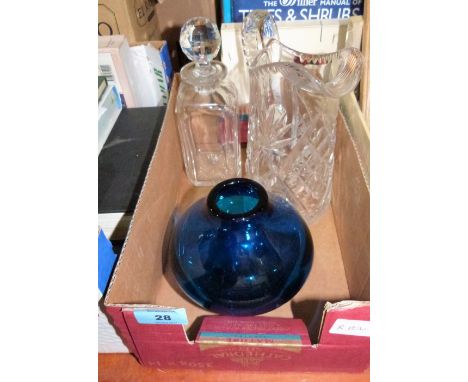 A cut glass water jug, a decanter and a blue glass vase