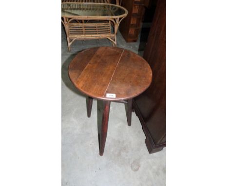 A country lamp table with round top on tripod support. 17'' diameter